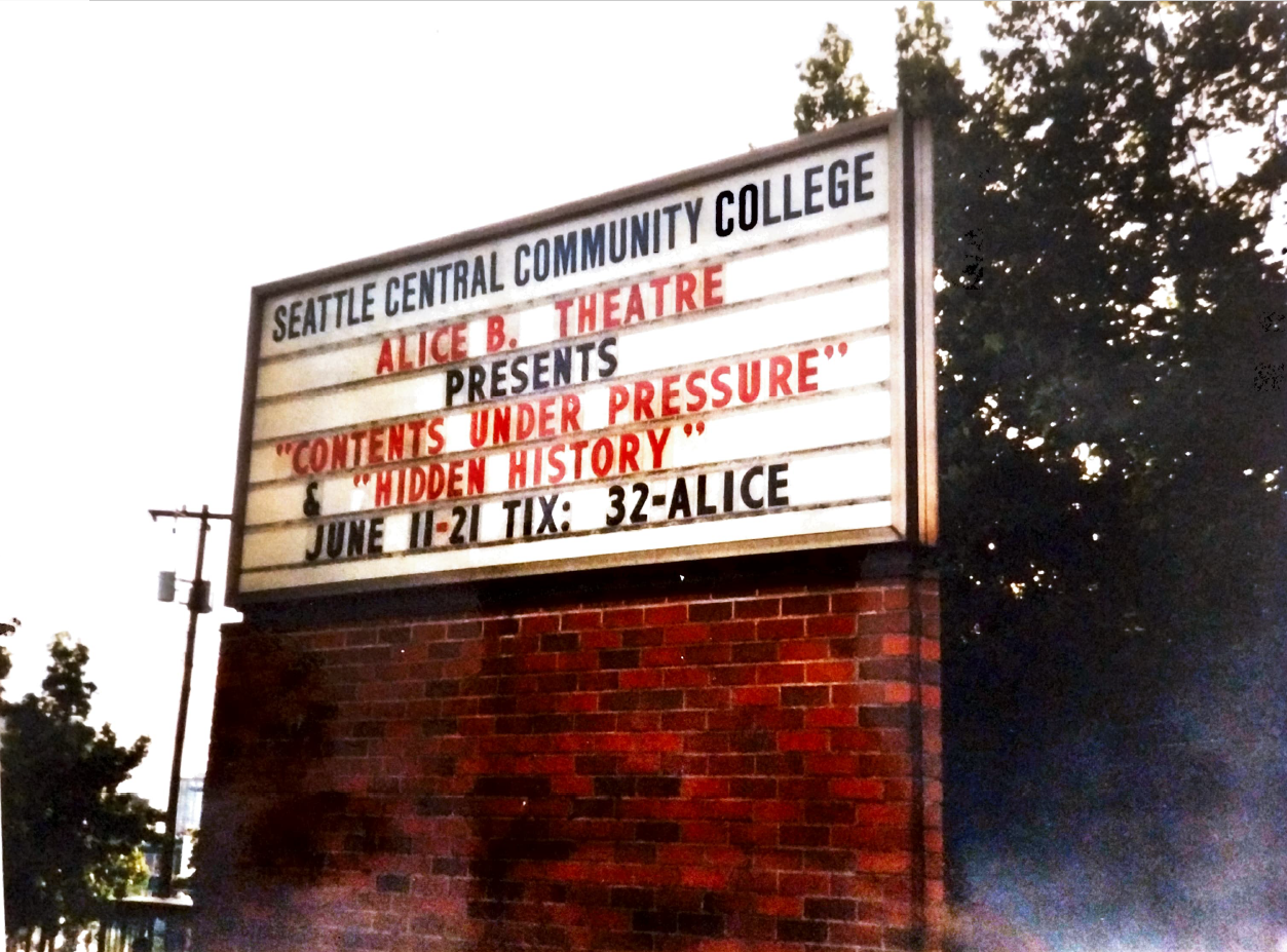 A sign for Seattle Central Community College that says: "Alice B. Theatre Presents "Contents Under Pressure" & "Hidden History" June 11-21 Tix: 32-ALICE