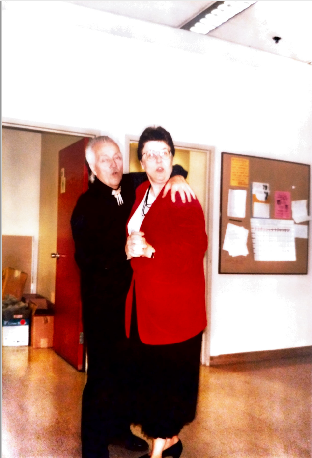 Photo of Stephen Blair (L) and Tamara Turner (R). They are clasping hands, and Stephen's arm is around Tamara's shoulder, as the face the camera.